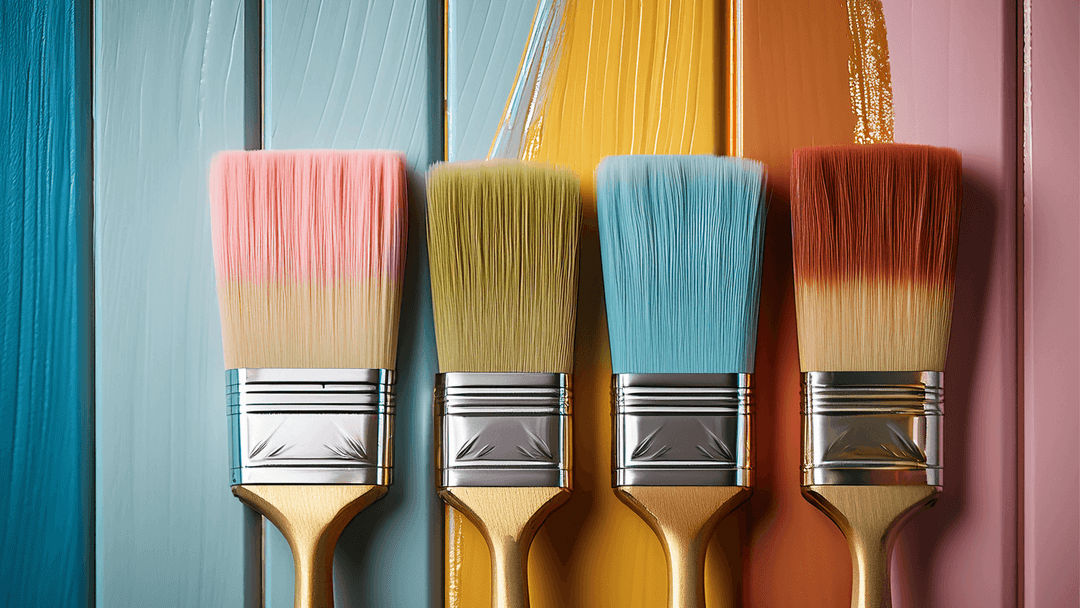 Paint brushes with paint of different colours on each