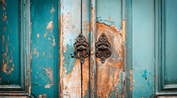 A Wooden Door with Paint Peeling Away